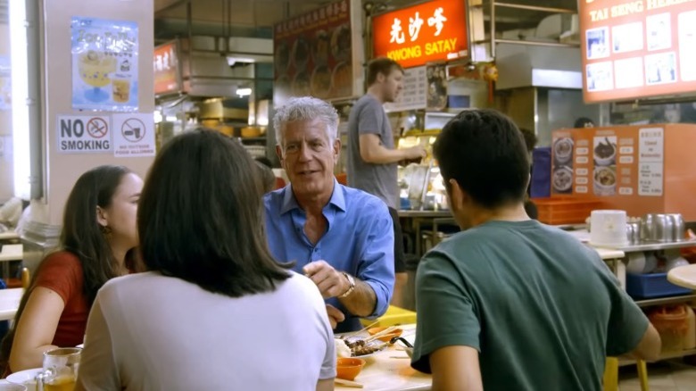 Anthony Bourdain eating with people in Singapore