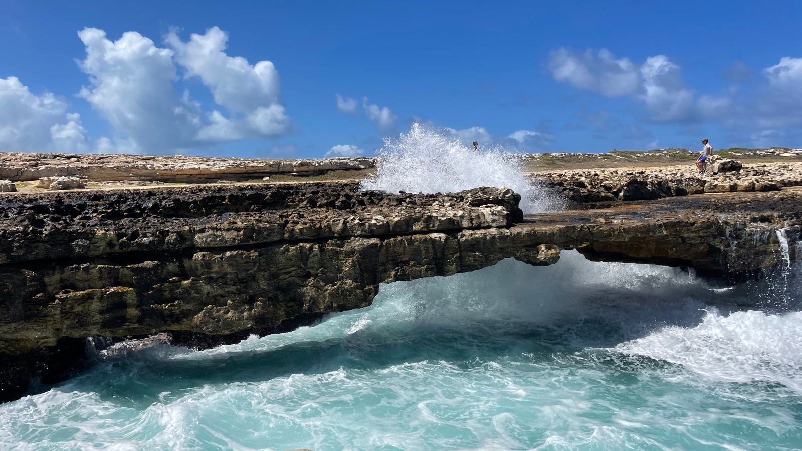 https://www.islands.com/img/gallery/antiguas-captivating-natural-bridge-promises-one-of-a-kind-striking-ocean-beauty-and-mystery/l-intro-1742063337.jpg