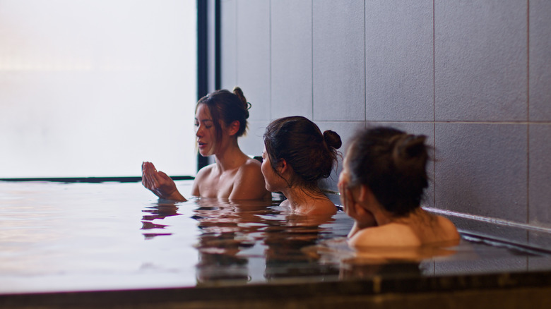 Women relaxing in an indoor hot spring in Japan