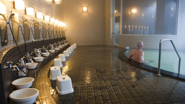Wash basins and stools for showering before entering the hot spring.