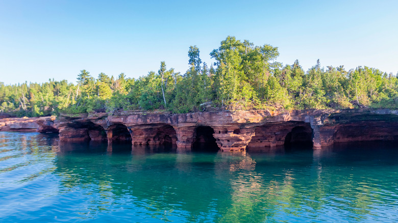 Red sandstone sea caves on Devil's Island in the Apostle Islands on a sunny day
