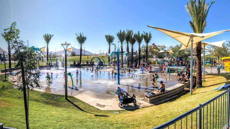 Kids playing on the splash pad at Gilbert Regional Park in Arizona