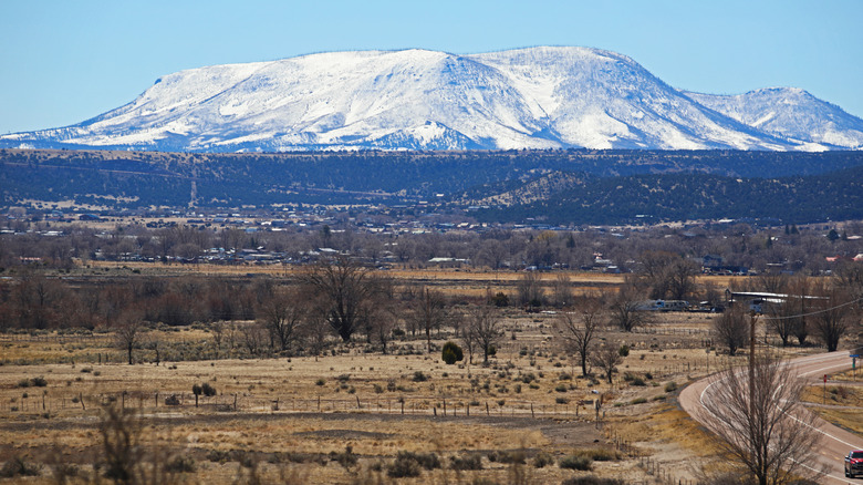 Town of Springerville in the foreground with snowcapped mountains in the background
