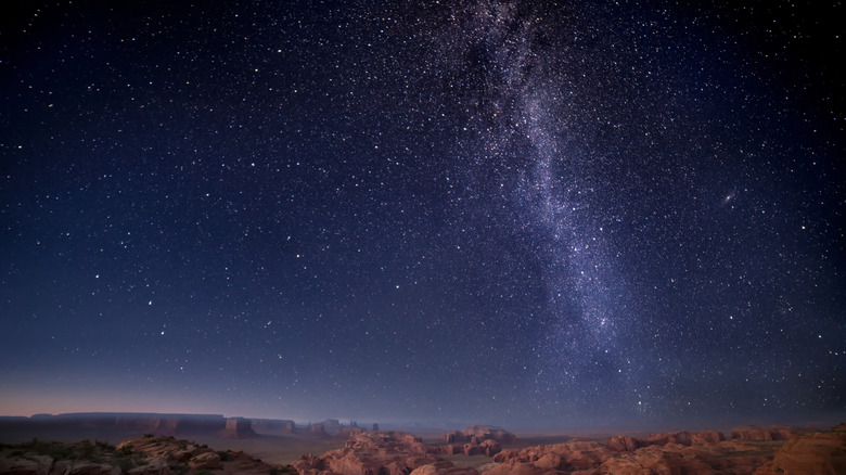 The Milky Way sparkles over the alien-looking terrain of Monument Valley, Arizona.