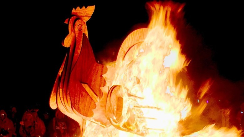 A burning effigy of a rooster at Saguaro Man in Arizona