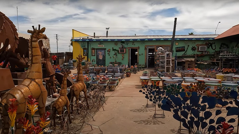 Kitschy roadside law decorations and shop exterior