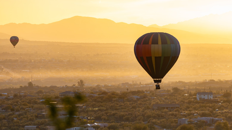 Hot air balloons at sunrise over Marana