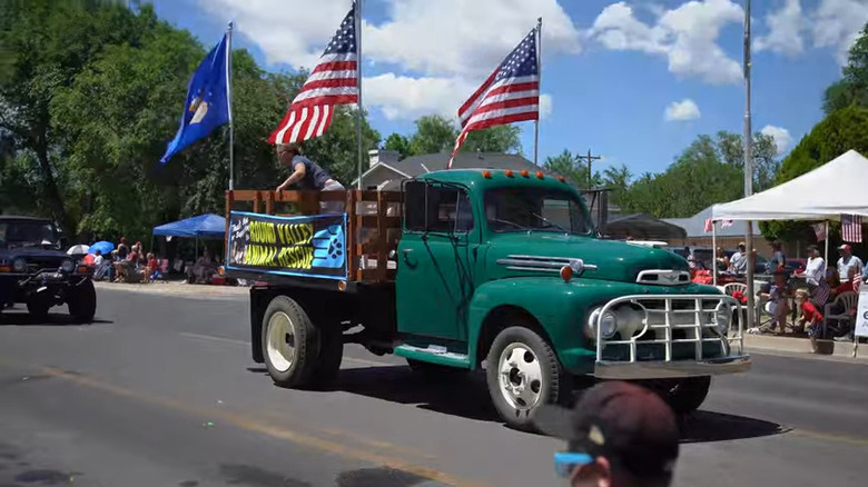 A truck with American Flags at the 4th of July parade