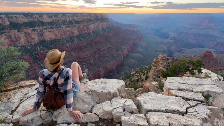 Woman with hat at Grand Canyon. View from Shoshone Point. Grand Canyon National Park. Arizona, USA