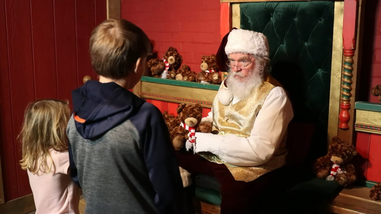 Kids meeting Santa at the North Pole Experience at Little America Flagstaff