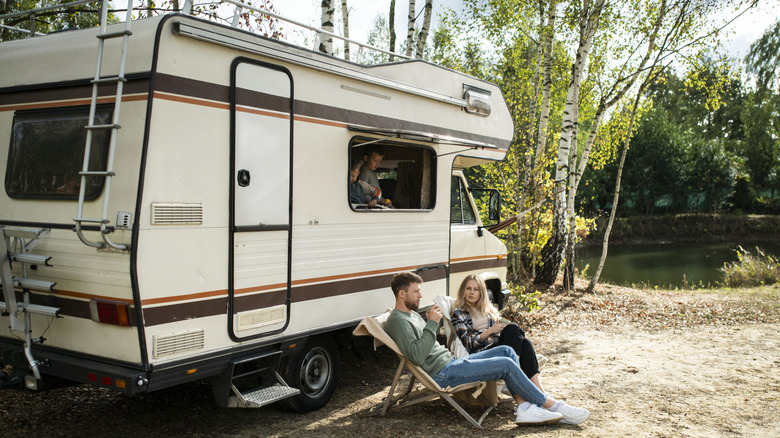 Family camping in an RV lakeside