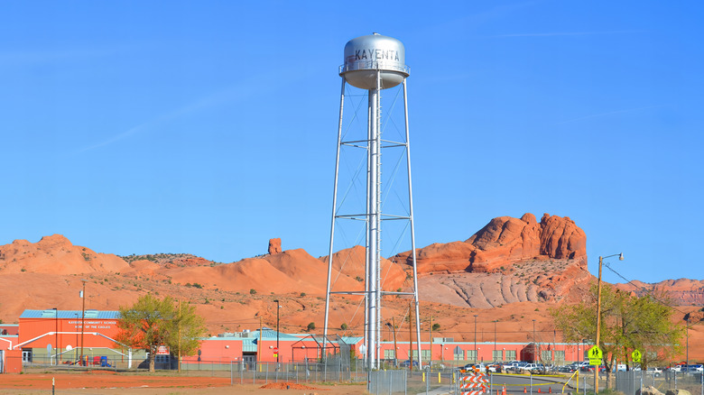Kayenta water tank in front of a red rock landscape in Arizona