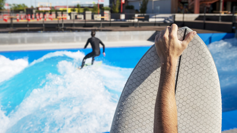 Riding waves at a surf park