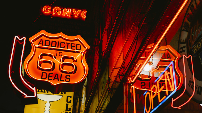Shops with neon signs line Route 66 in downtown Williams
