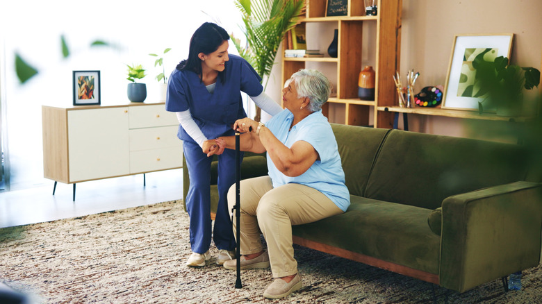 Live-in nurse working with senior woman