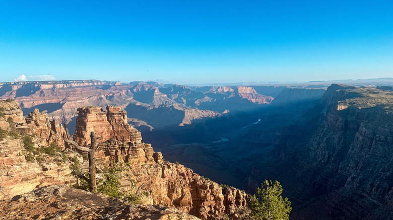 Sun shines over rim of Grand Canyon from Desert View Campground
