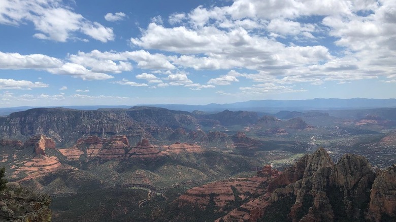 Panoramic view of Sedona red rocks blue sky with clouds from Wilson Mountain