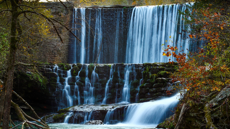 A multi-tiered waterfall flowing over a dam in Arkansas