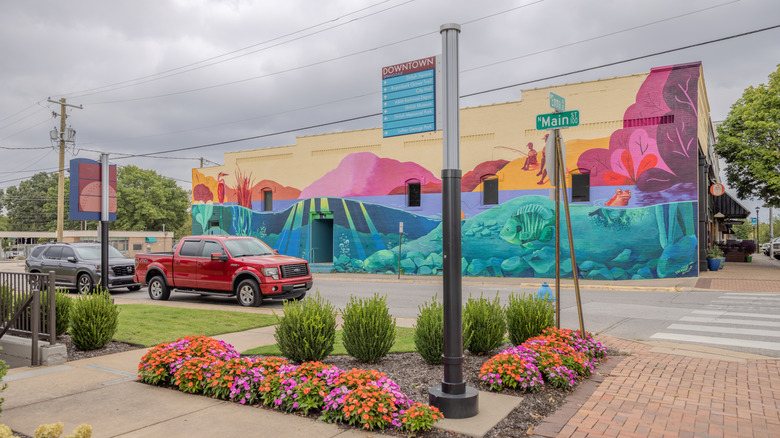 A vibrant fishing mural on the side of a building in Downtown Springdale in Arkansas.
