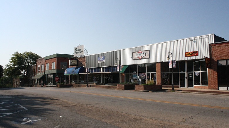 Historic storefronts and local businesses lining a quiet street in the Pocahontas Commercial Historic District, Arkansas