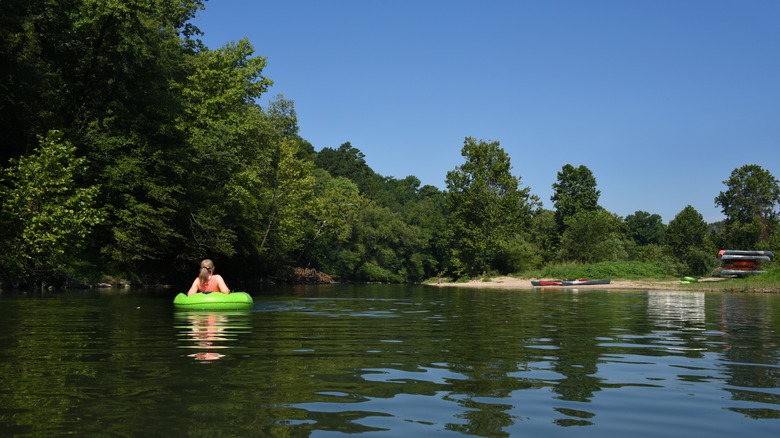 Woman floats in Caddo River