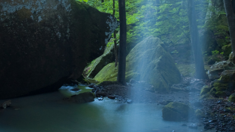 Light glinting off the small pool beneath the waterfall in Pam's Grotto