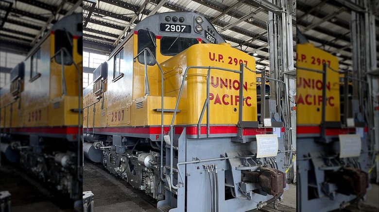 A yellow locomotive on display at the Arkansas Railroad Museum, Pine Bluff, Arkansas