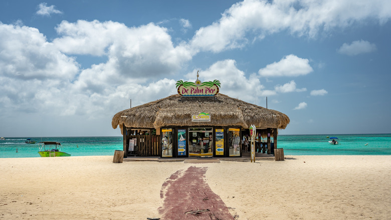 Path on the beach leading to De Palm Pier building