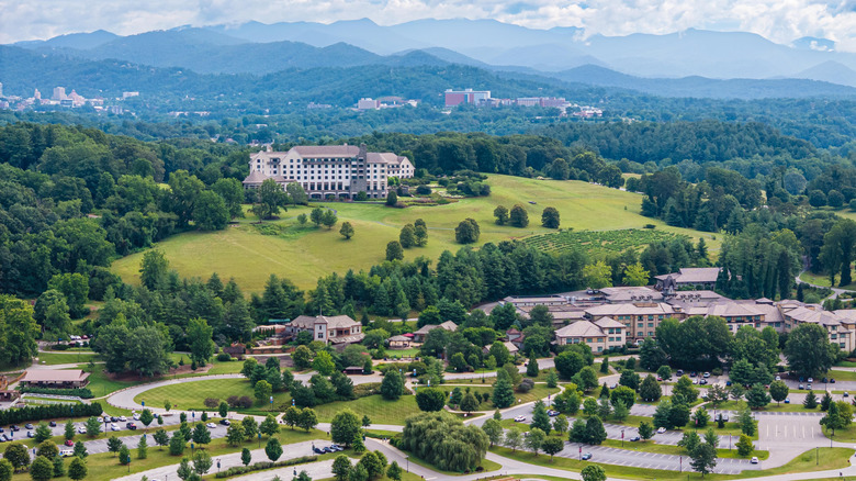 Aerial view of Biltmore Village area in Asheville, North Carolina, with Blue Ridge Mountains in the background