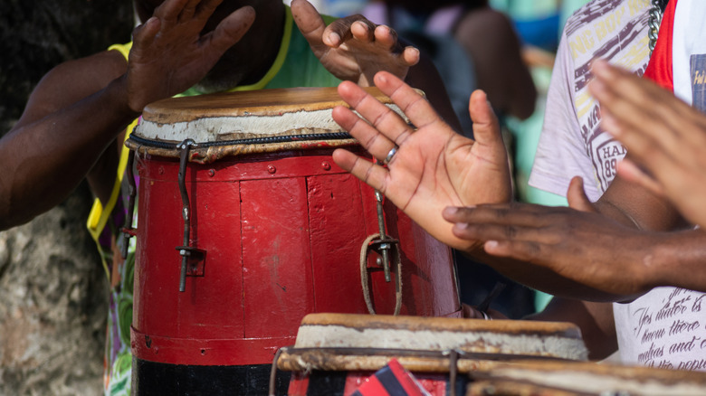 People playing hand drums.