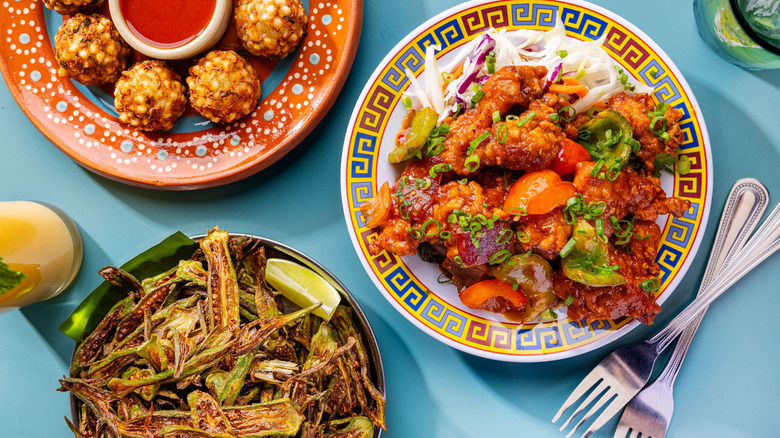 Colorful plated dishes from Chai Pani Asheville