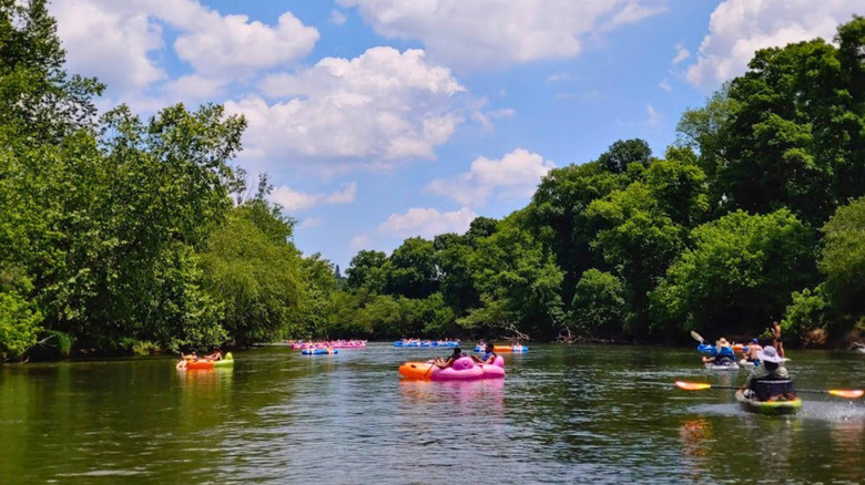 Visitors at Carrier Park boating and tubing in the French Broad River, Asheville, North Carolina
