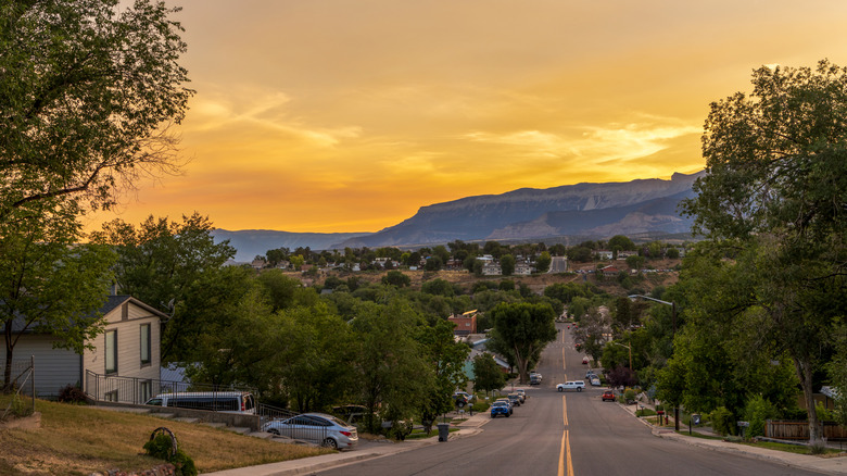 Cars line the streets of Rifle, Colorado, below the Rocky Mountains