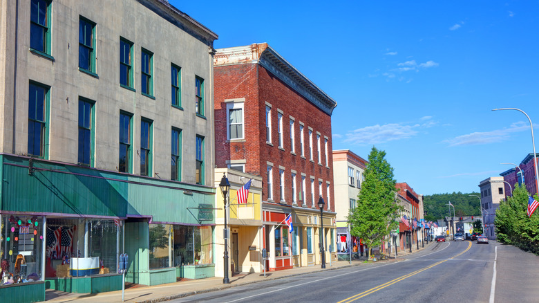 Street lined with shops and three-story buildings in Athol, Massachusetts