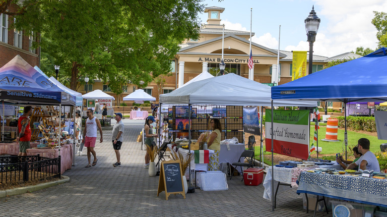 People visiting booths at the Sunday Market in Smyrna Georgia, held at Smyrna Market Village