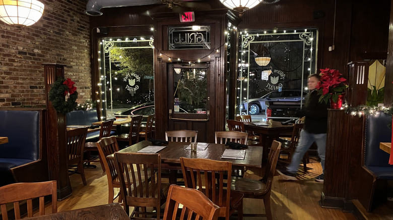 The rustic interior of Atkins Park Restaurant & Bar in Atlanta, Georgia, with dining tables and booths