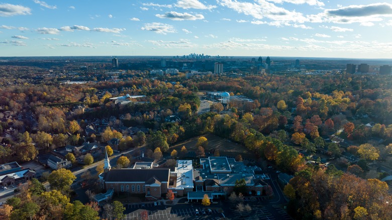 Aerial view of Dunwoody, Georgia with buildings and trees showing during the day.