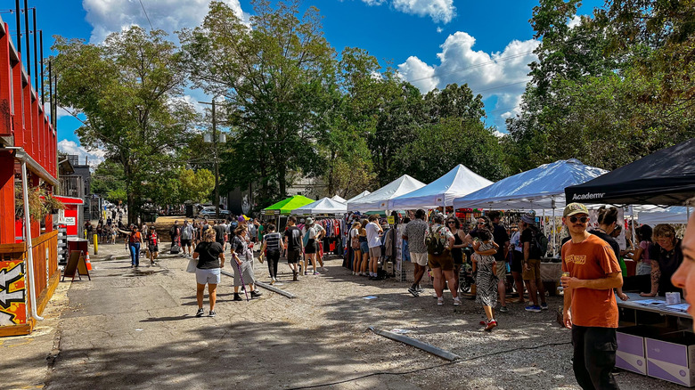 Vendors and visitors wandering at the East Atlanta Strut festival in East Atlanta Village, Georgia