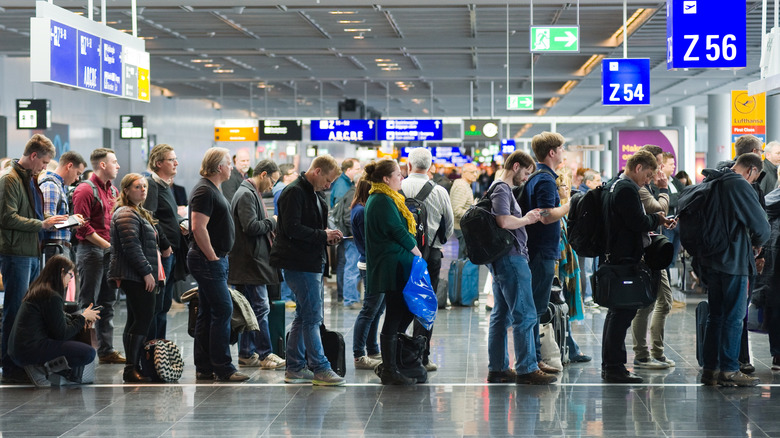 annoyed passengers waiting to board