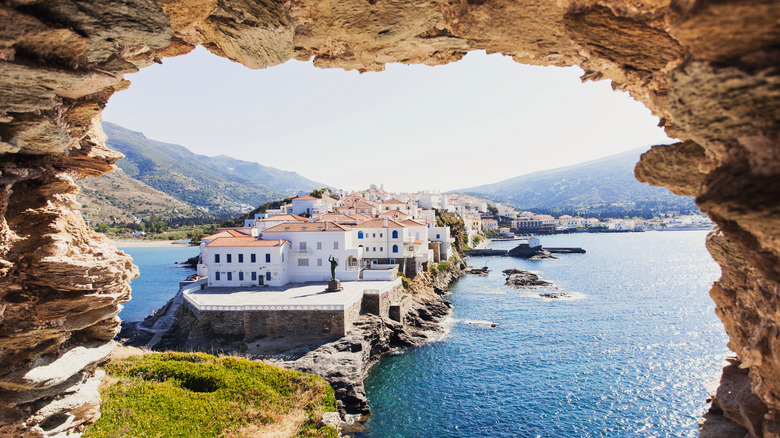 Looking out at Andros, Greece through a rock