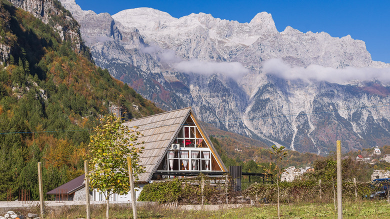 An alpine village with a mountain backdrop in Theth, Albania