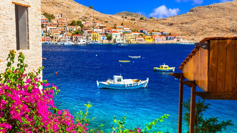 Greek harbor with flowers in front
