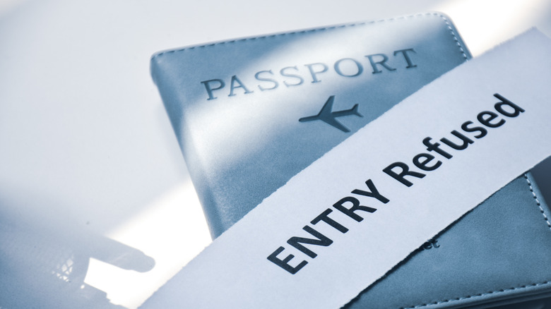 Entry denied slip over a passport