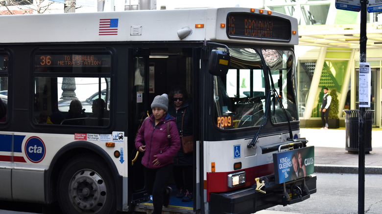 Passengers exiting a Chicago bus through the front door