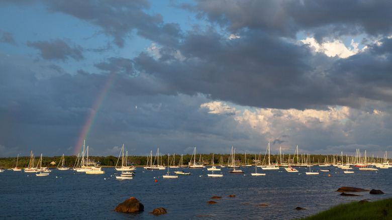 Boats and harbor in Marion, Massachusetts with rainbow overhead