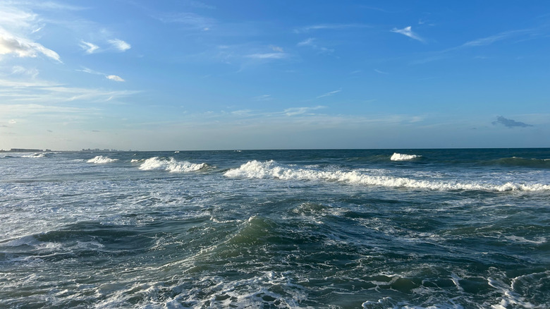 Rolling waves crash in the shallows at Ponce Inlet, Florida.