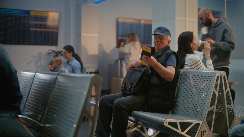 Man waiting on cancelled plane