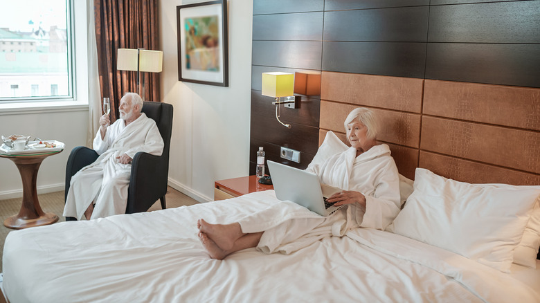 Two older people in a hotel