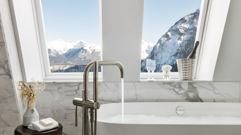 The Crown Suite marble bathroom with soaking tub at the Fairmont Banff Springs