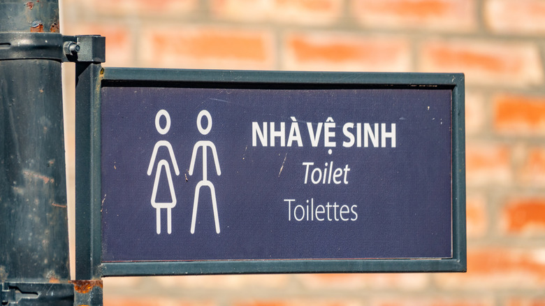 Signboard with different translations of toilet